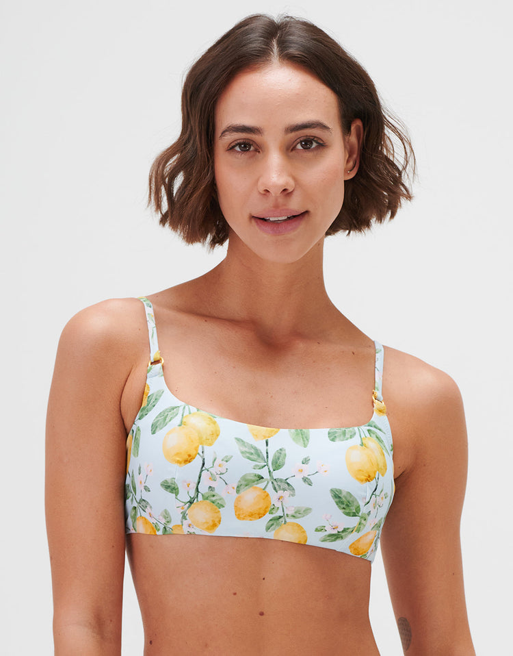 Women's luxury bikini top in a lemon print with adjustable straps and a square neckline.